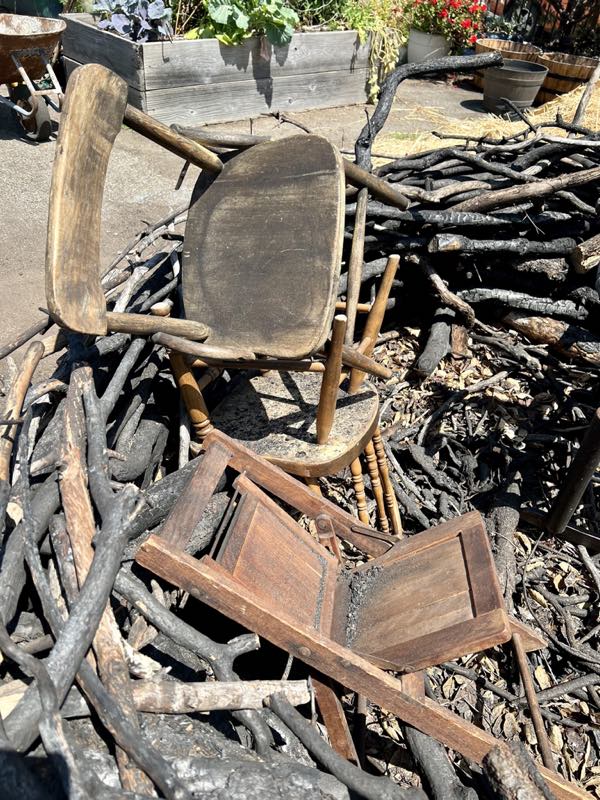 Detail of tumbled chairs inside next